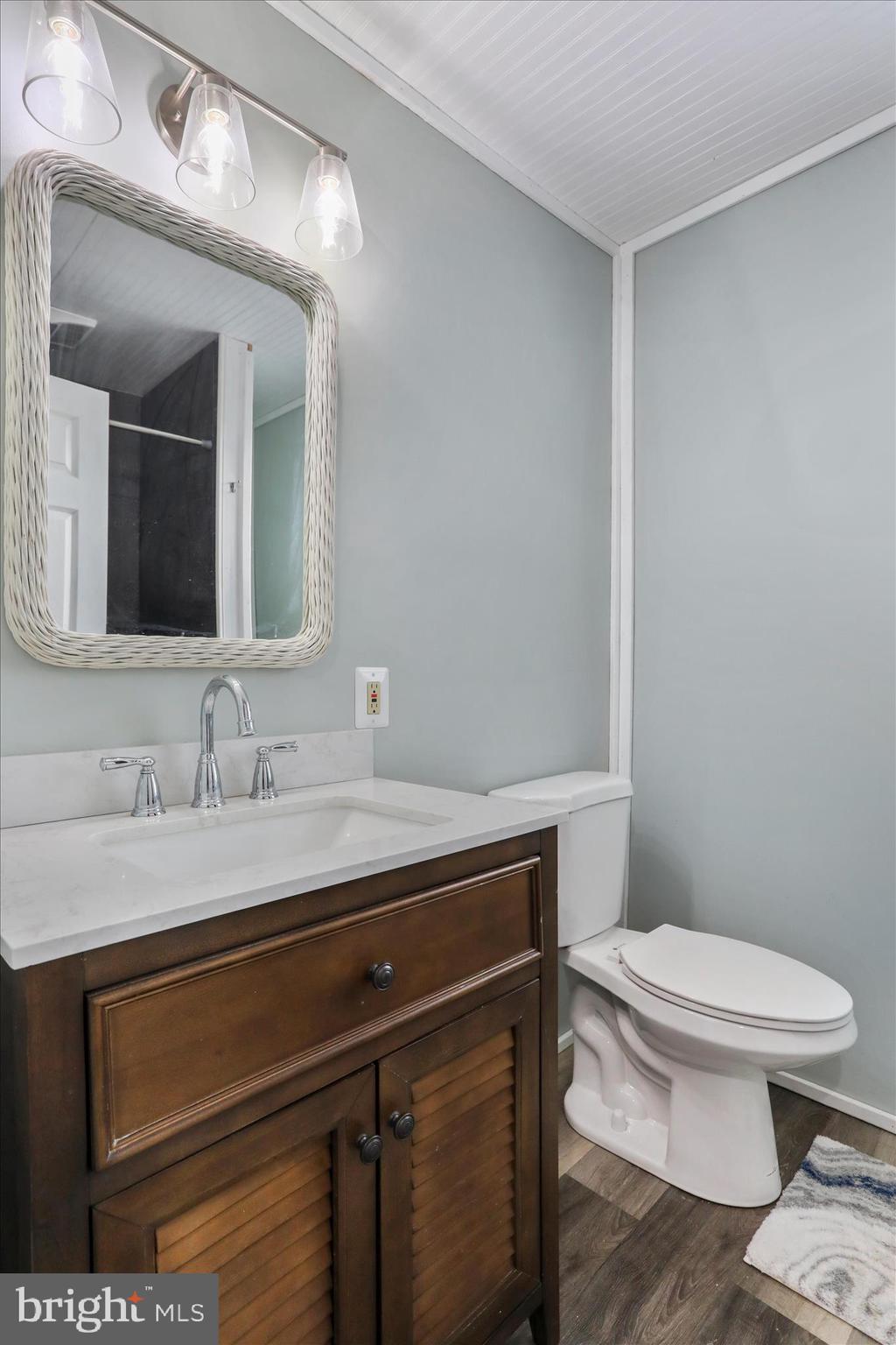 83 Dove Hill Drive Ranson, WV 25438 - Photo 42 of 71 a bathroom with a toilet a sink and mirror