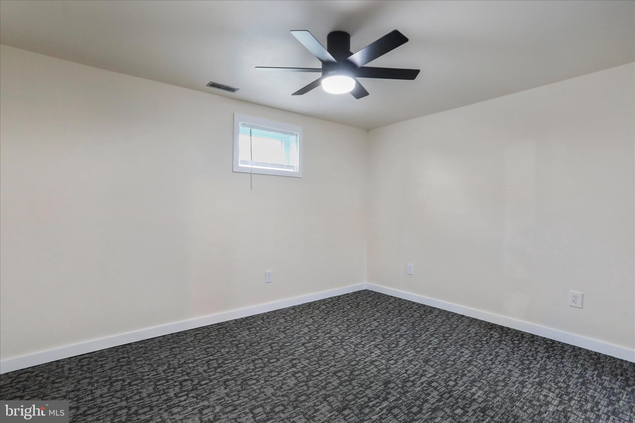 83 Dove Hill Drive Ranson, WV 25438 - Photo 45 of 71 an empty room with a window and a fan
