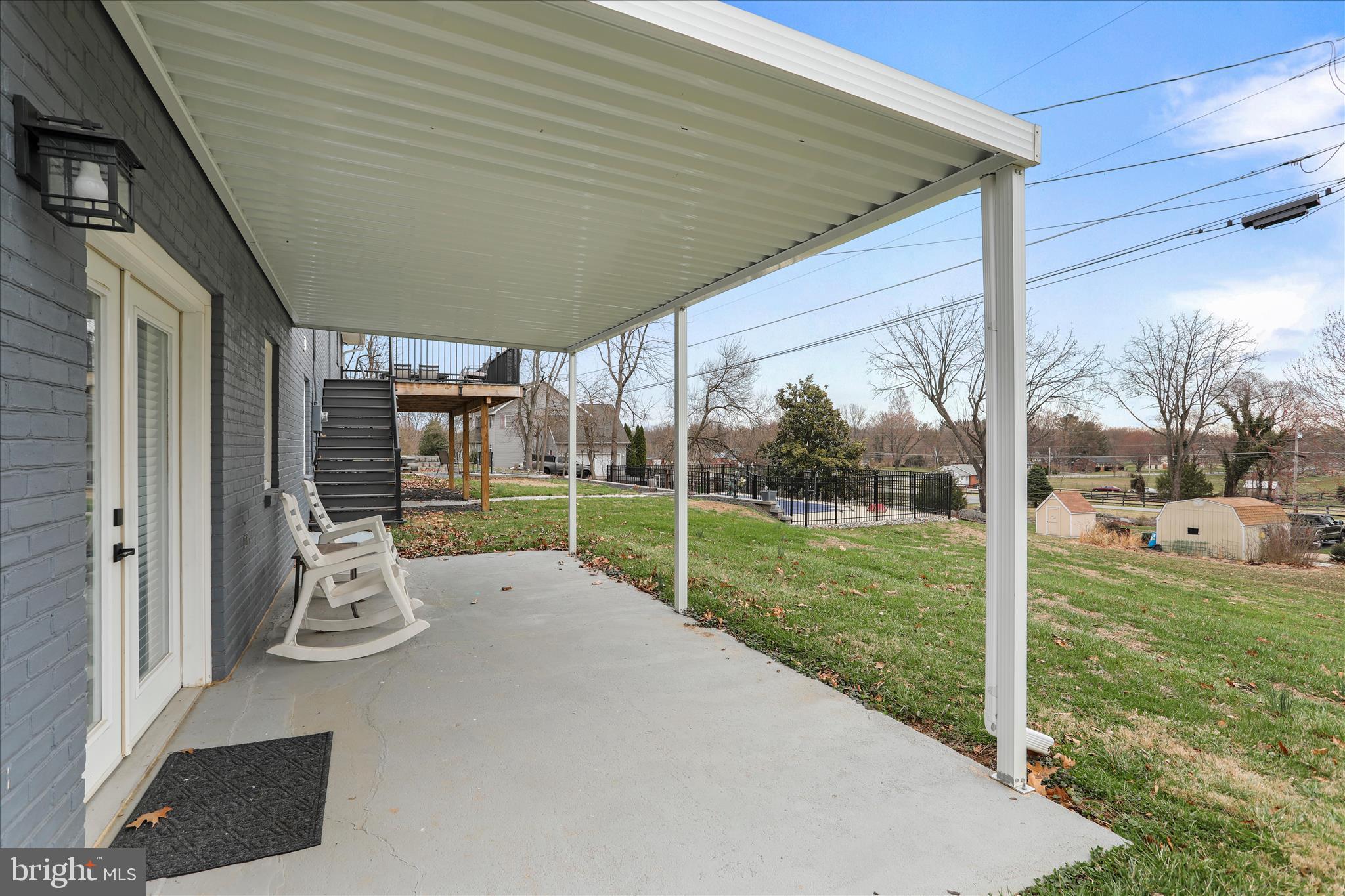 83 Dove Hill Drive Ranson, WV 25438 - Photo 47 of 71 a view of a porch with furniture and garden