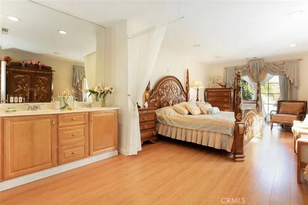 a bedroom with a bed and a view of bedroom