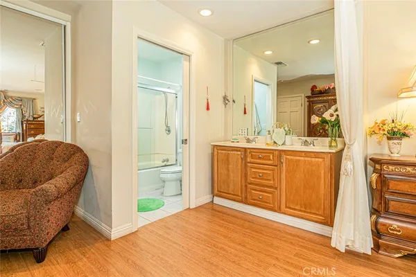 a bathroom with a sink a mirror and a shower