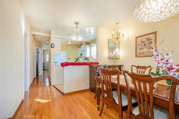 a view of a dining room with furniture and wooden floor