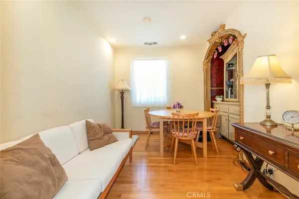 a living room with furniture a table and a chandelier
