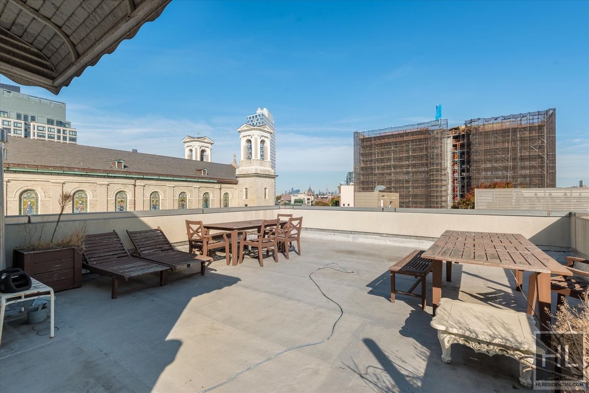 727 Dean Street, Unit 2F Brooklyn, NY 11238 - Photo 13 of 16 a view of a patio with dining table and chairs with a barbeque grill and plants