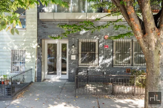 a view of a cars park in front of a building