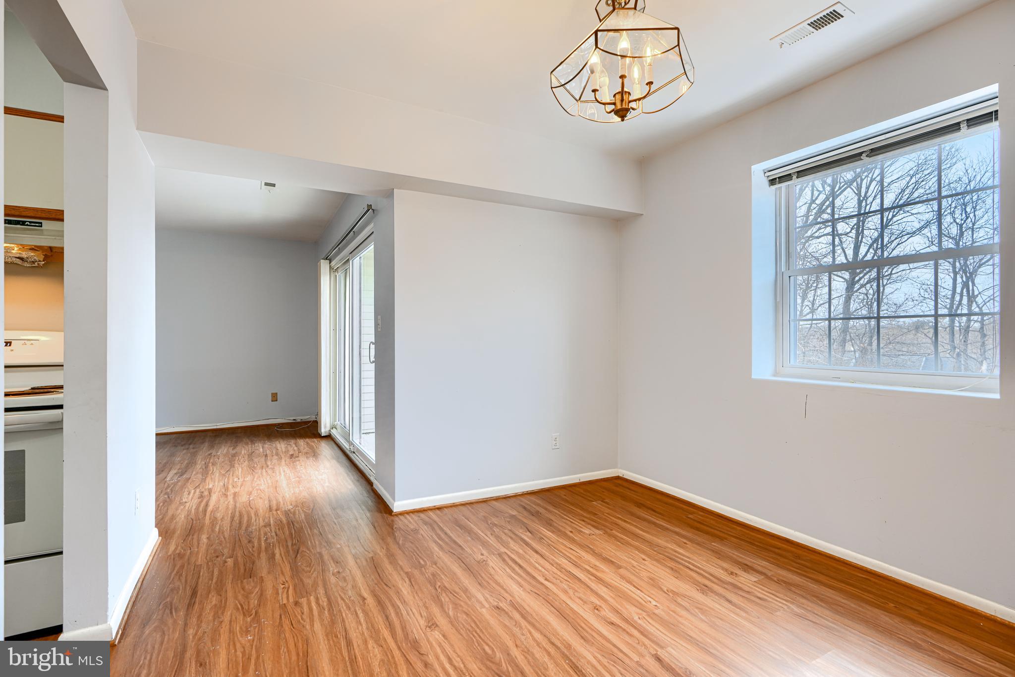 110 Castletown Road, Unit 201 Lutherville-Timonium, MD 21093 - Photo 11 of 41 wooden floor in an empty room with a window