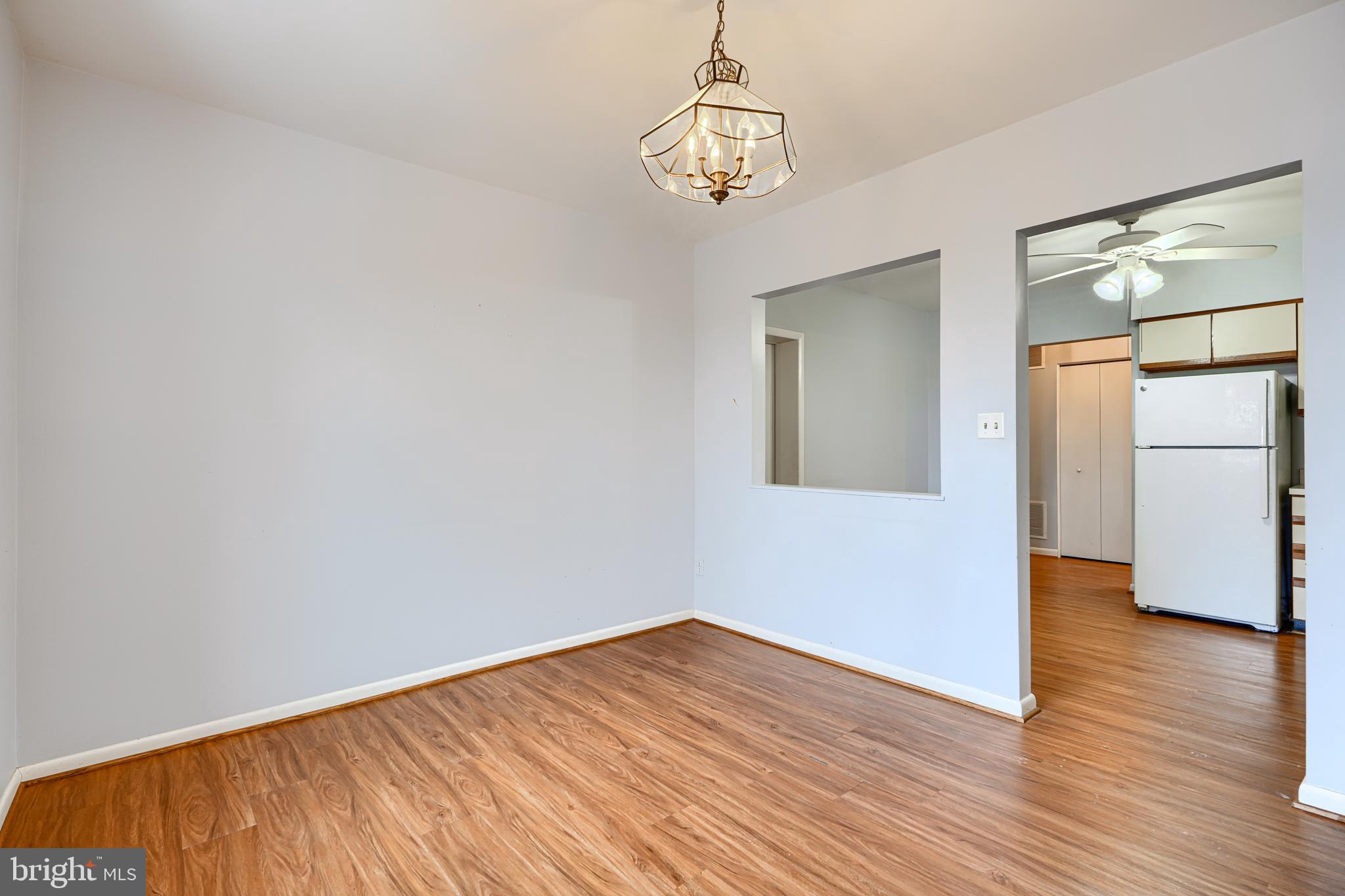 110 Castletown Road, Unit 201 Lutherville-Timonium, MD 21093 - Photo 13 of 41 a view of empty room with wooden floor and window