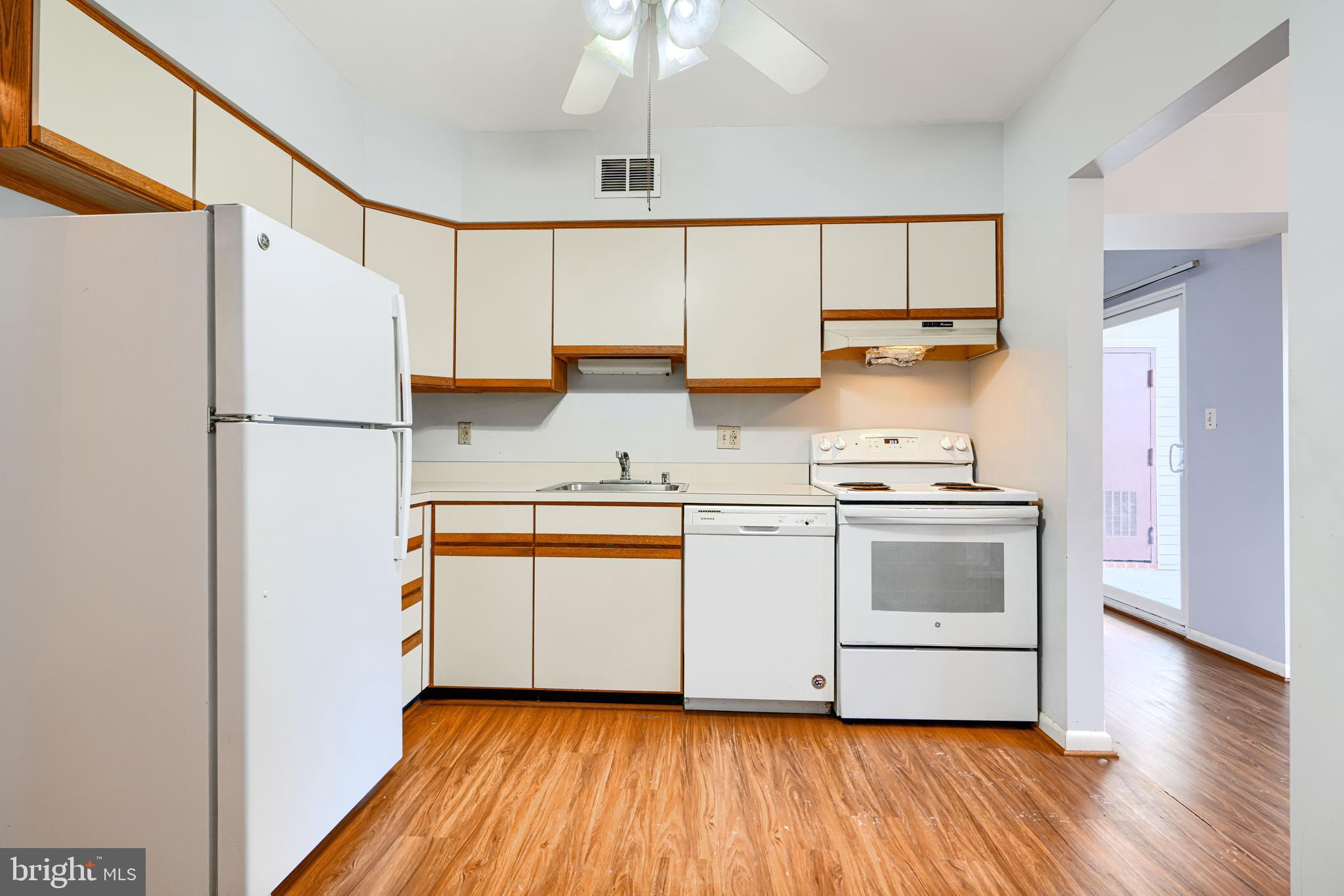 110 Castletown Road, Unit 201 Lutherville-Timonium, MD 21093 - Photo 17 of 41 a kitchen with white cabinets and white appliances