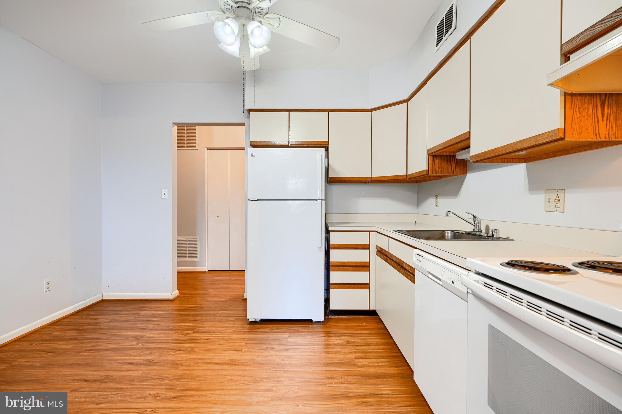110 Castletown Road, Unit 201 Lutherville-Timonium, MD 21093 - Photo 19 of 41 a kitchen with a refrigerator and a stove