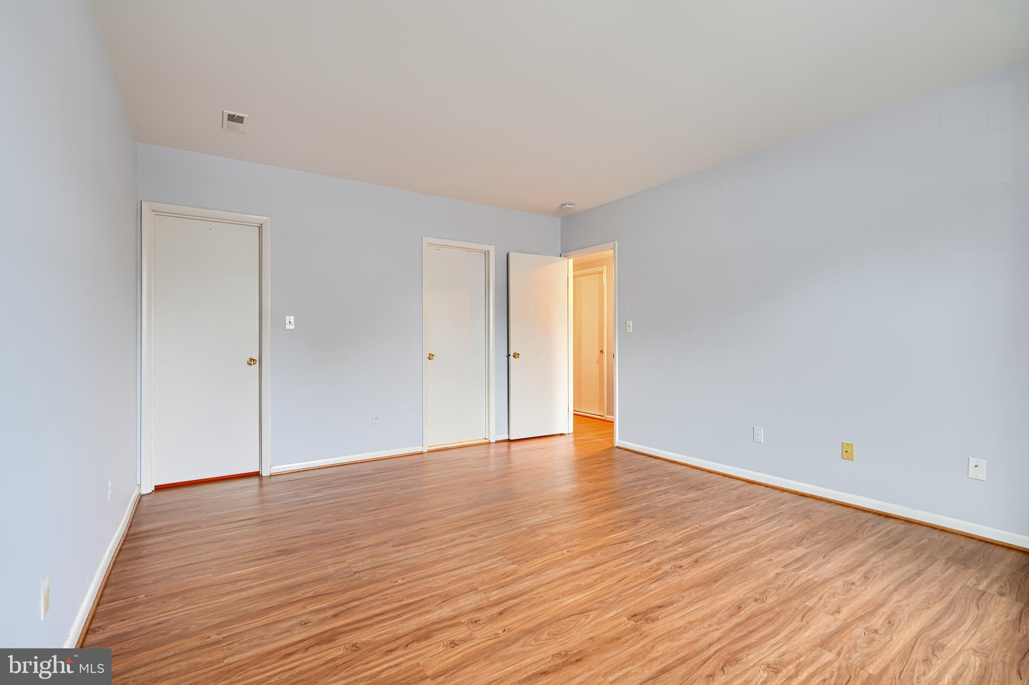 110 Castletown Road, Unit 201 Lutherville-Timonium, MD 21093 - Photo 21 of 41 a view of an empty room with wooden floor