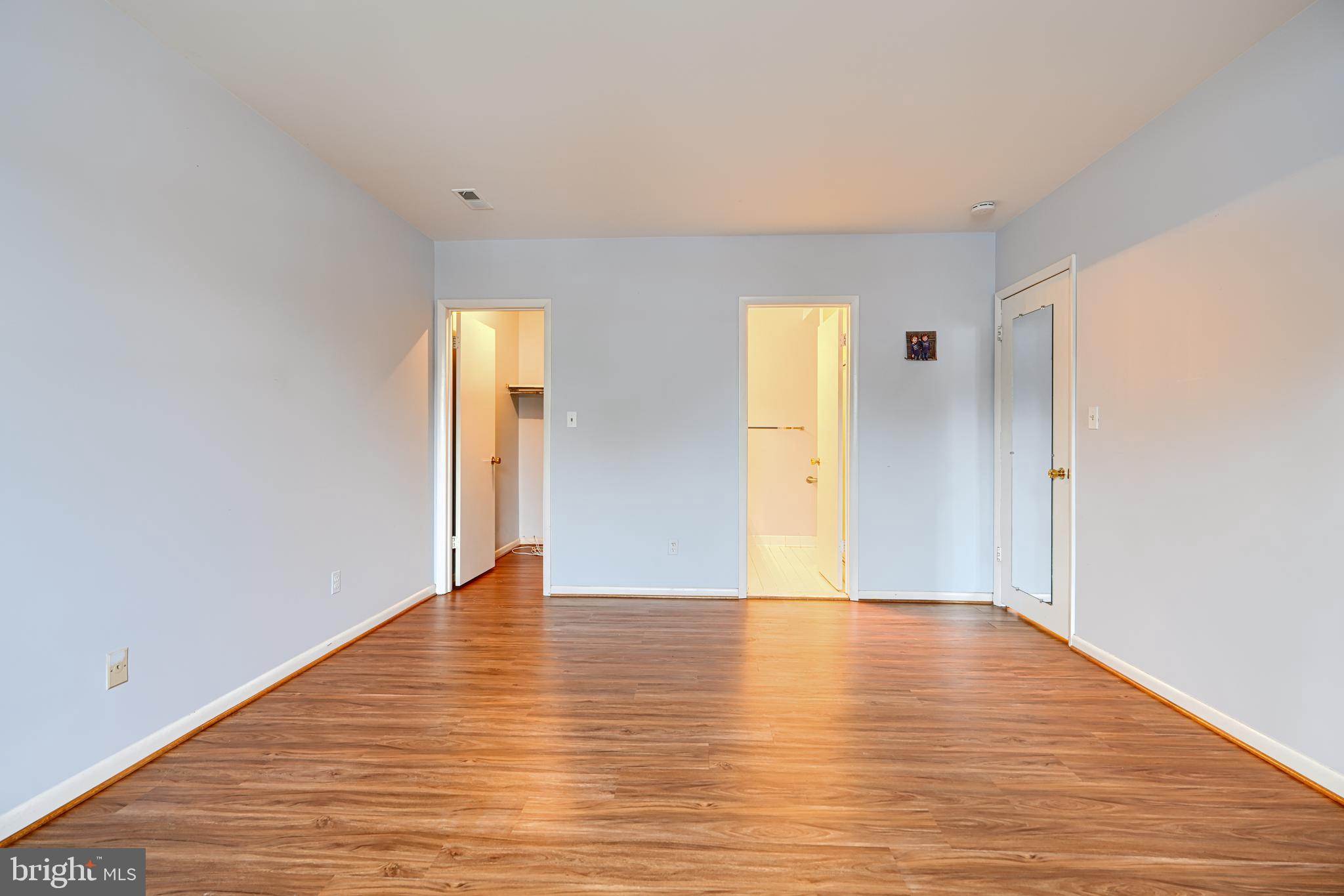 110 Castletown Road, Unit 201 Lutherville-Timonium, MD 21093 - Photo 22 of 41 a view of an empty room with wooden floor