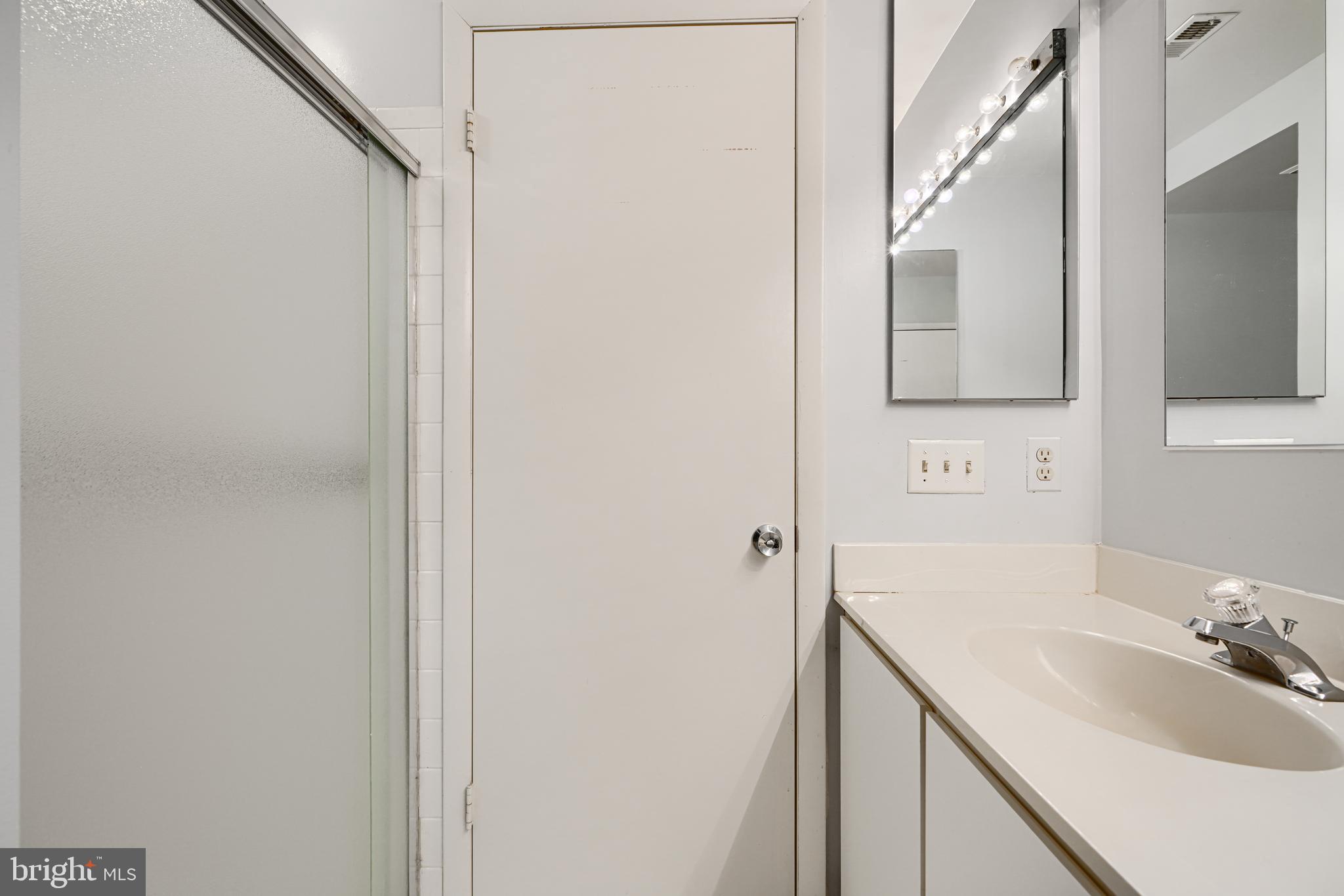 110 Castletown Road, Unit 201 Lutherville-Timonium, MD 21093 - Photo 26 of 41 a bathroom with a sink and a mirror