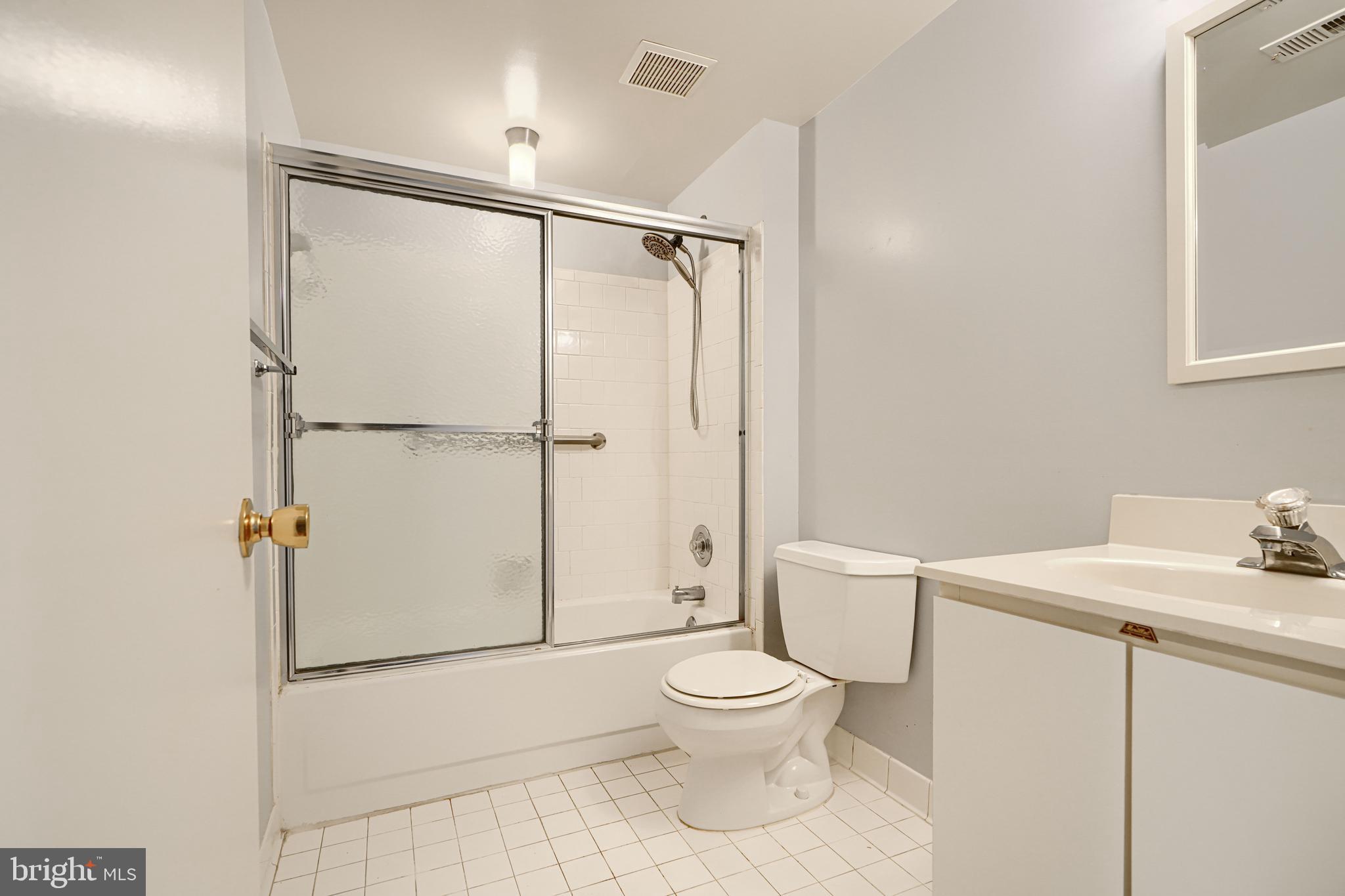 110 Castletown Road, Unit 201 Lutherville-Timonium, MD 21093 - Photo 35 of 41 a white toilet sitting next to a bathroom sink