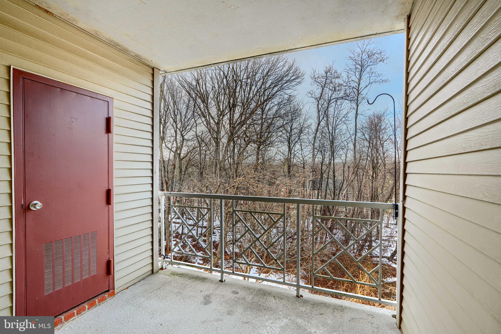 110 Castletown Road, Unit 201 Lutherville-Timonium, MD 21093 - Photo 40 of 41 a view of a door and wooden floor