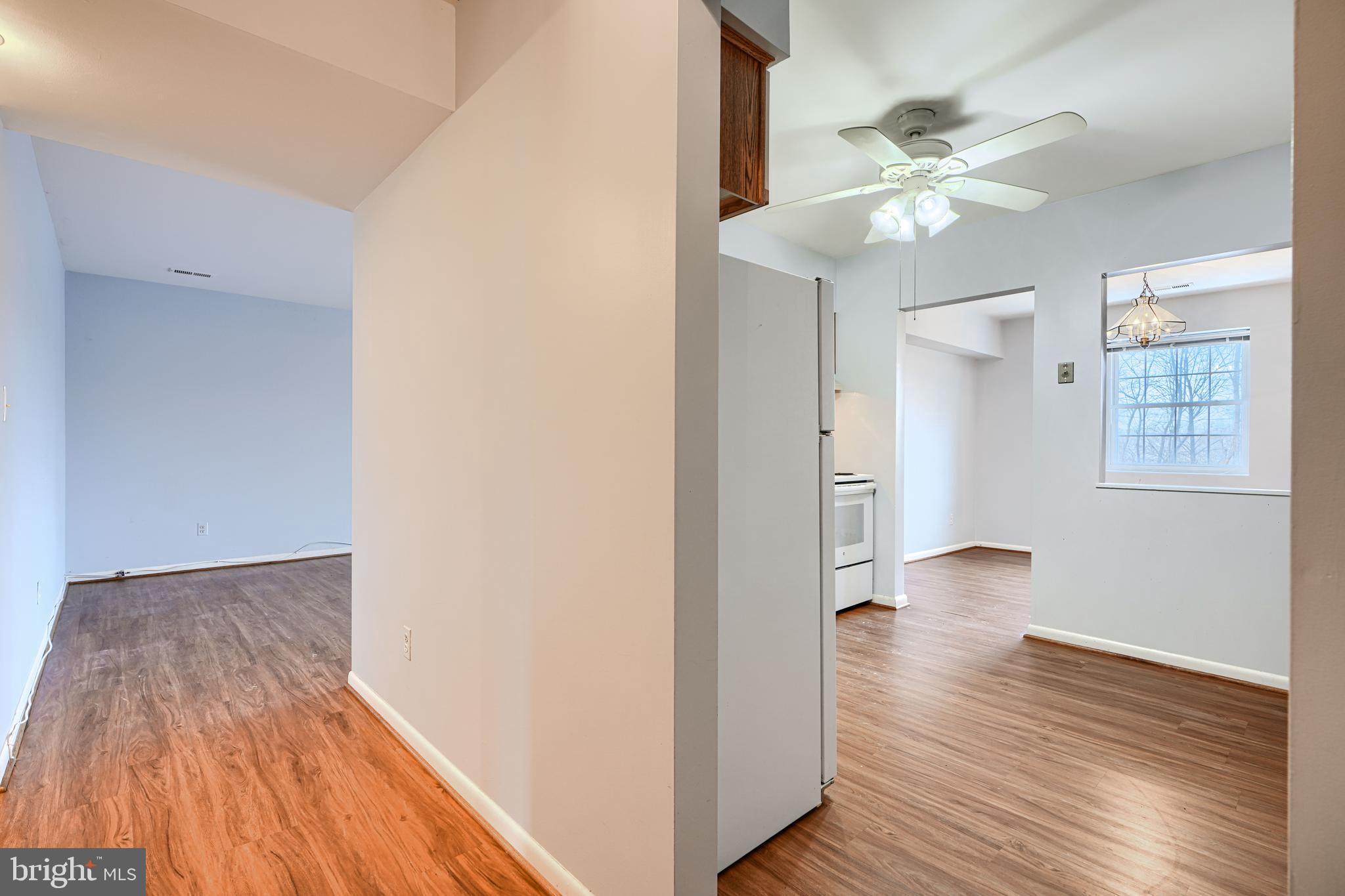 110 Castletown Road, Unit 201 Lutherville-Timonium, MD 21093 - Photo 5 of 41 a view of an empty room and wooden floor