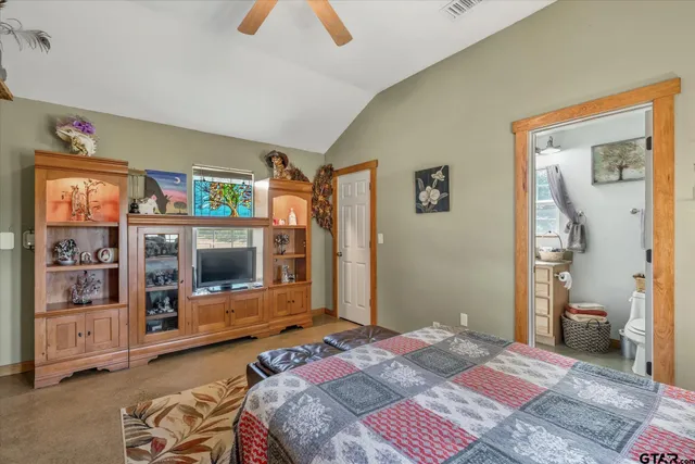 a bedroom with a bed and walk in closet