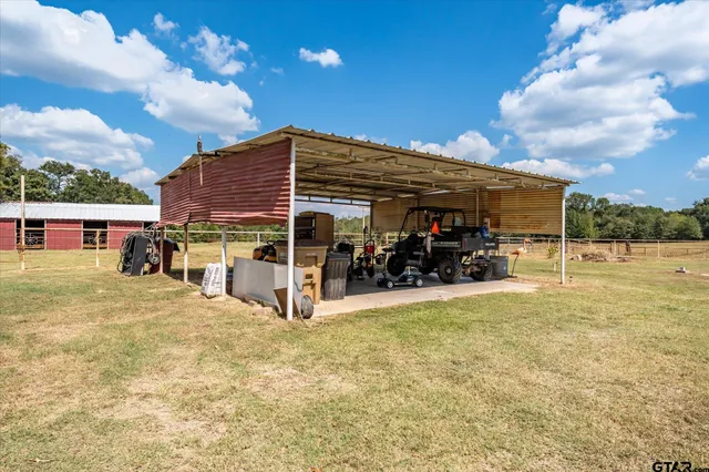 a view of a house with swimming pool and sitting area
