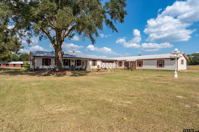 a front view of houses with yard