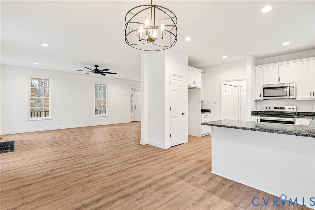 4715 Shannon Hill Road Columbia, VA 23038 - Photo 11 of 52 a view of a kitchen with wooden floor and electronic appliances