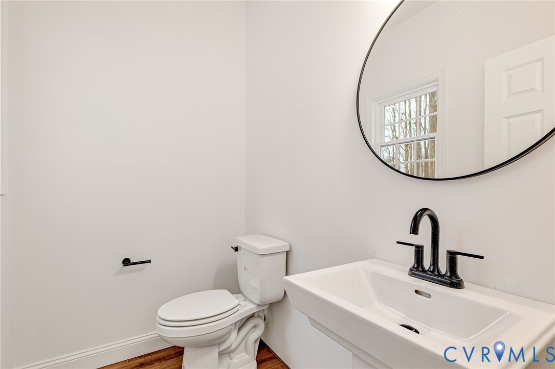 4715 Shannon Hill Road Columbia, VA 23038 - Photo 16 of 52 a bathroom with a sink and mirror