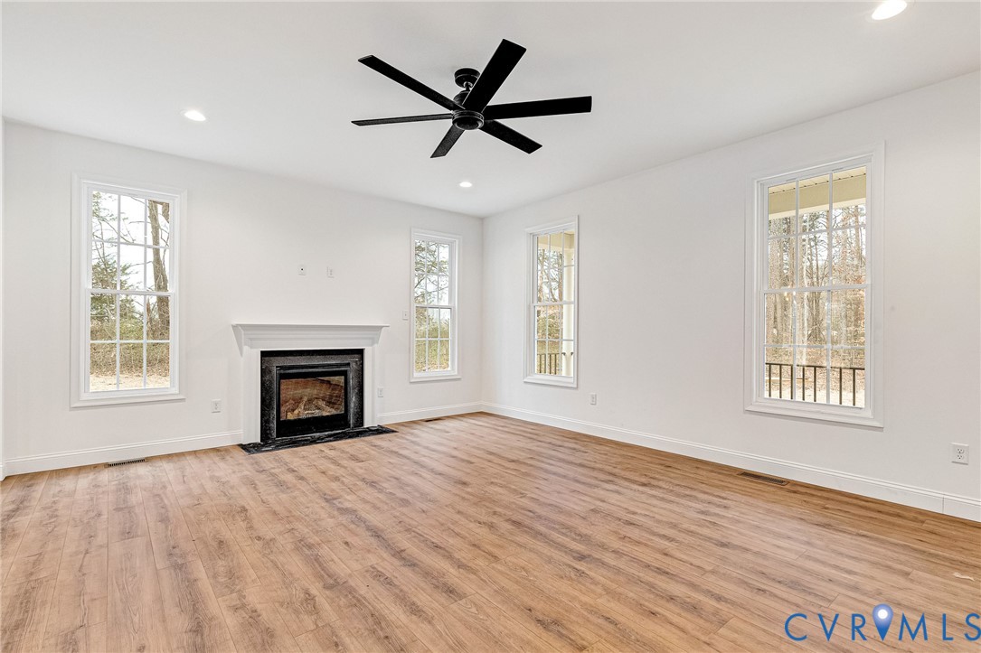 4715 Shannon Hill Road Columbia, VA 23038 - Photo 23 of 52 a view of empty room with wooden floor and a window