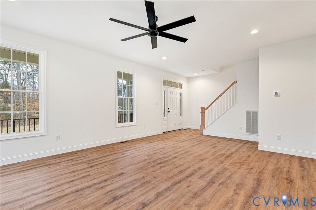 4715 Shannon Hill Road Columbia, VA 23038 - Photo 24 of 52 a view of empty room with wooden floor and fan