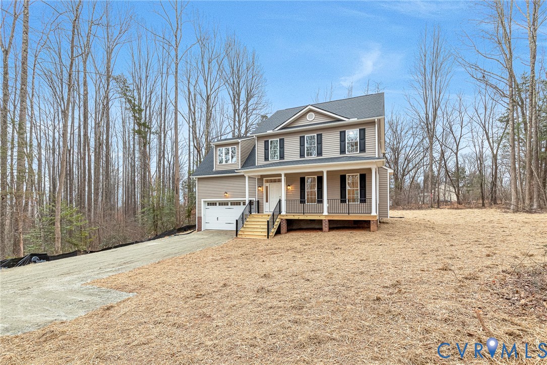 4715 Shannon Hill Road Columbia, VA 23038 - Photo 3 of 52 a front view of a house with a yard