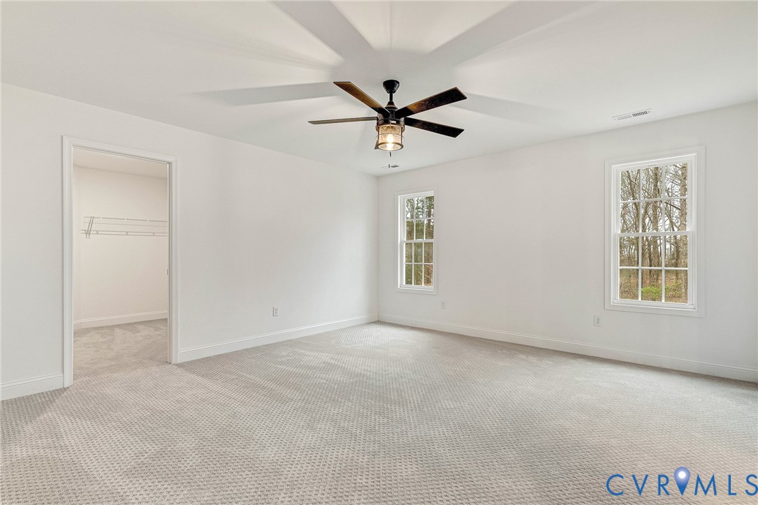 4715 Shannon Hill Road Columbia, VA 23038 - Photo 34 of 52 an empty room with windows and fan