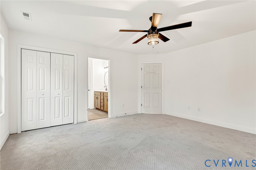 4715 Shannon Hill Road Columbia, VA 23038 - Photo 35 of 52 an empty room with closet and windows