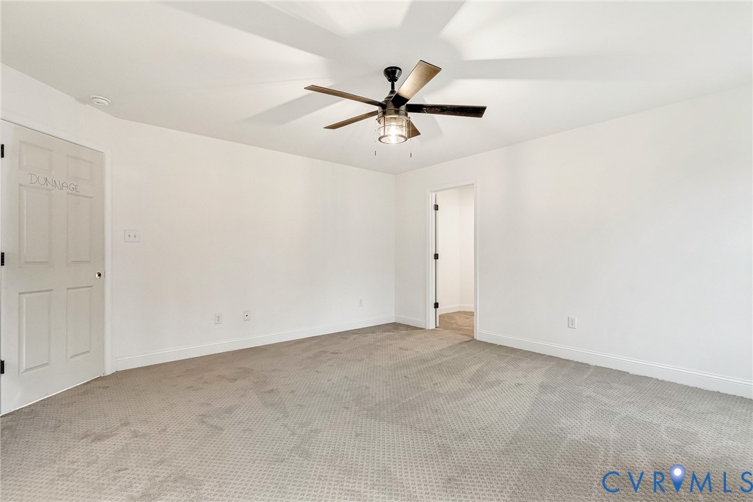 4715 Shannon Hill Road Columbia, VA 23038 - Photo 36 of 52 an empty room with a ceiling fan and a window