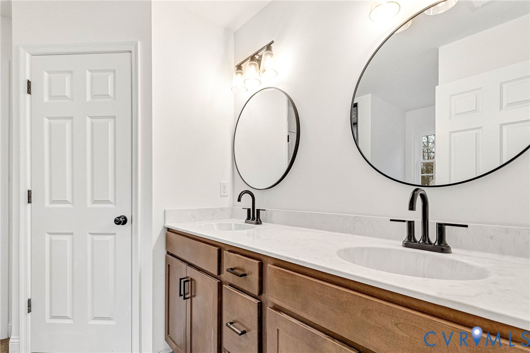 4715 Shannon Hill Road Columbia, VA 23038 - Photo 39 of 52 a bathroom with a sink and a mirror