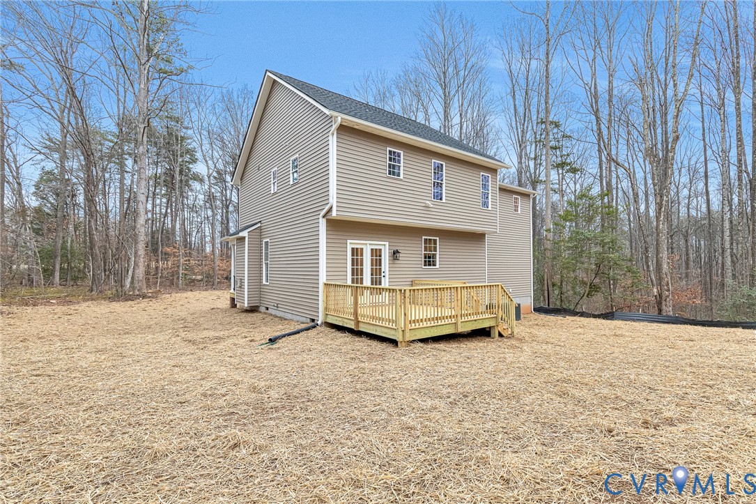 4715 Shannon Hill Road Columbia, VA 23038 - Photo 48 of 52 a view of a house with backyard and trees