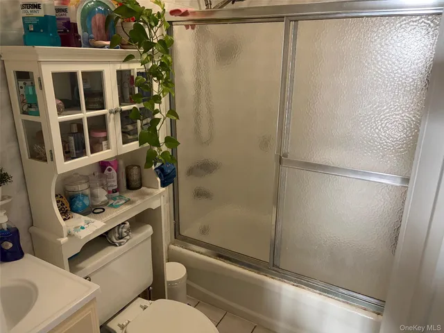 a bathroom with a shower and a toilet
