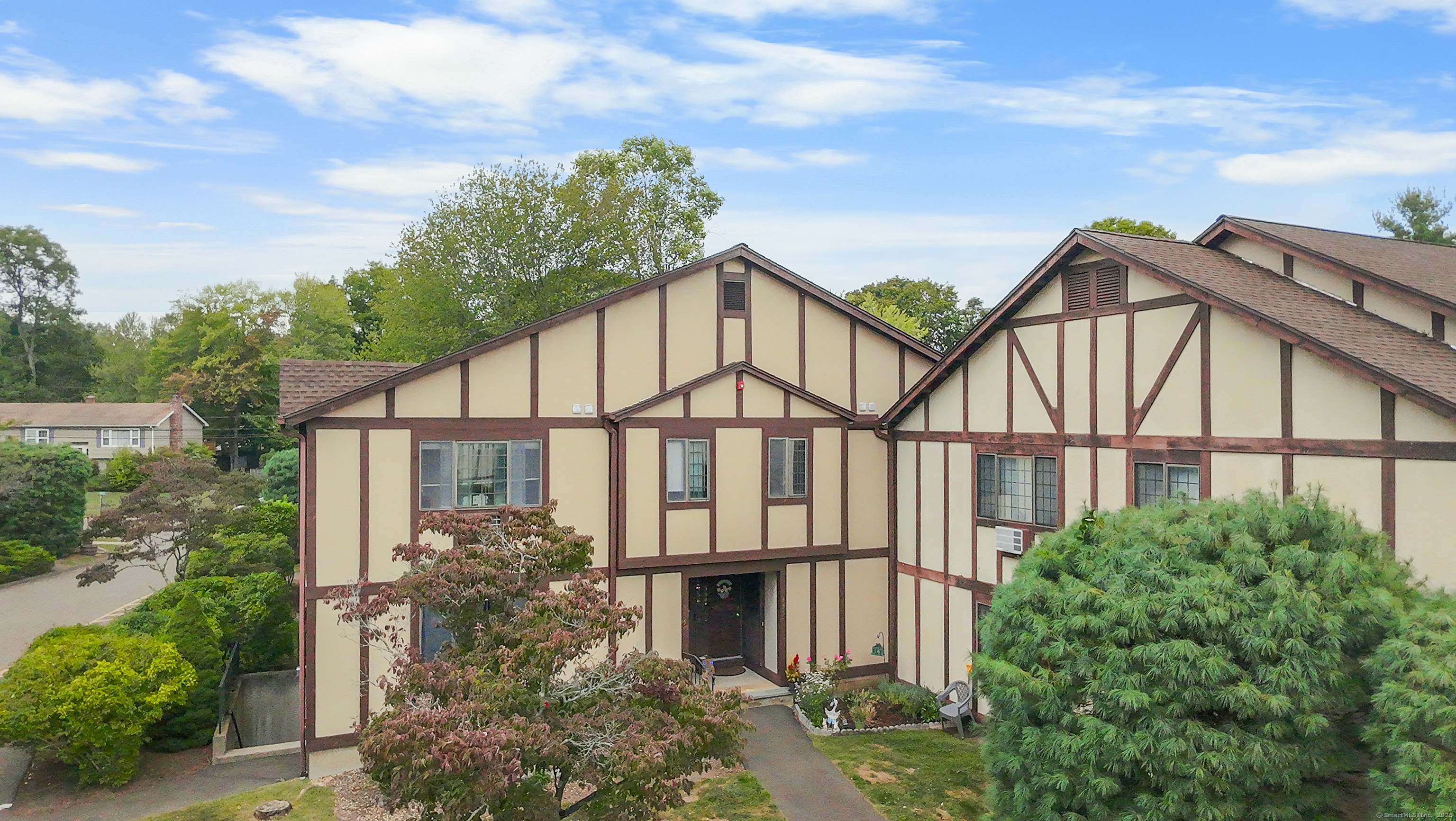 a front view of a house with garden