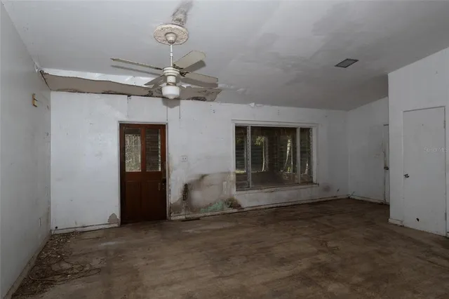 an empty room with wooden floor