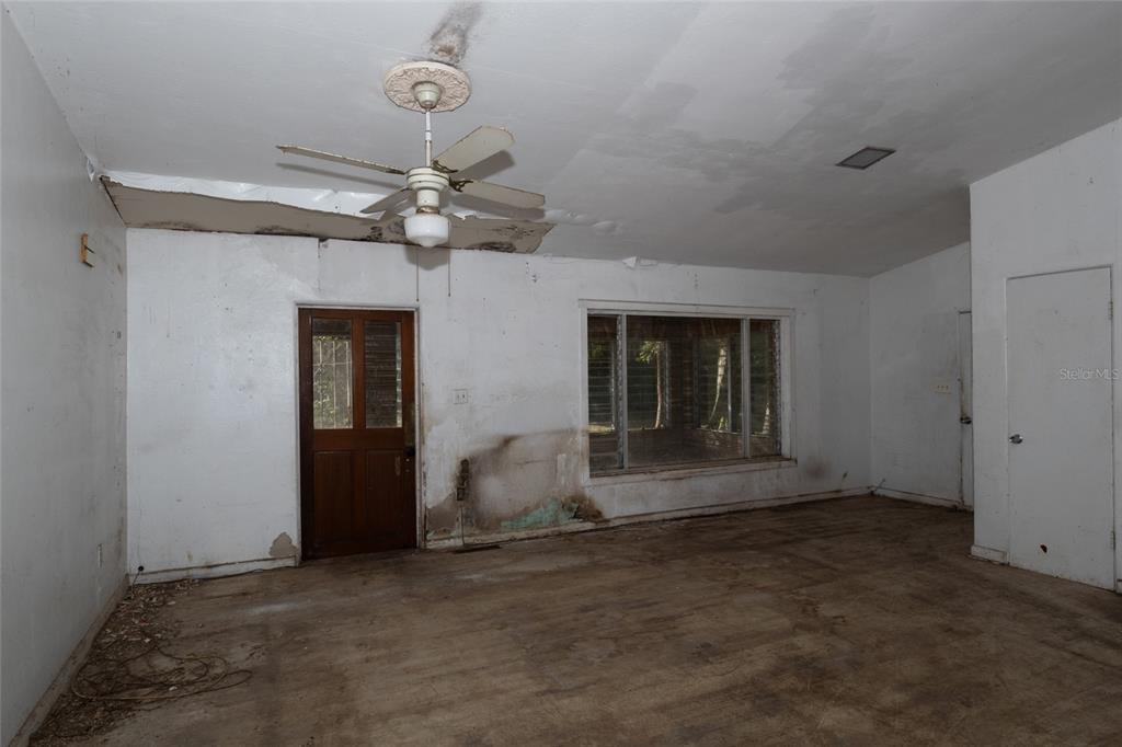4711 Rio Grande Avenue Orlando, FL 32839 - Photo 32 of 38 a view of a livingroom with a ceiling fan and window