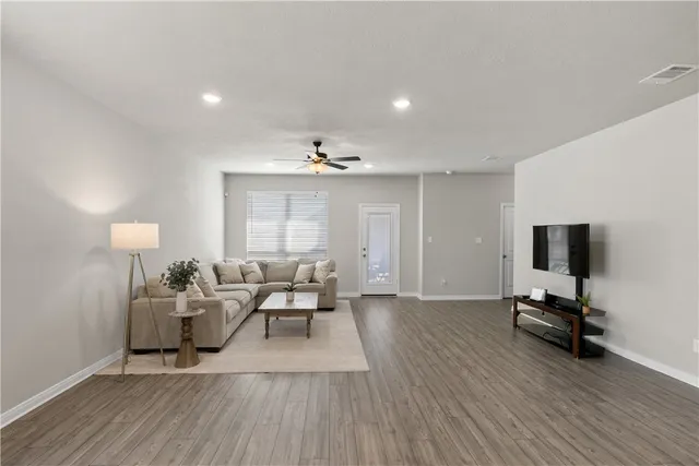 a view of a room with gym equipment and a large window