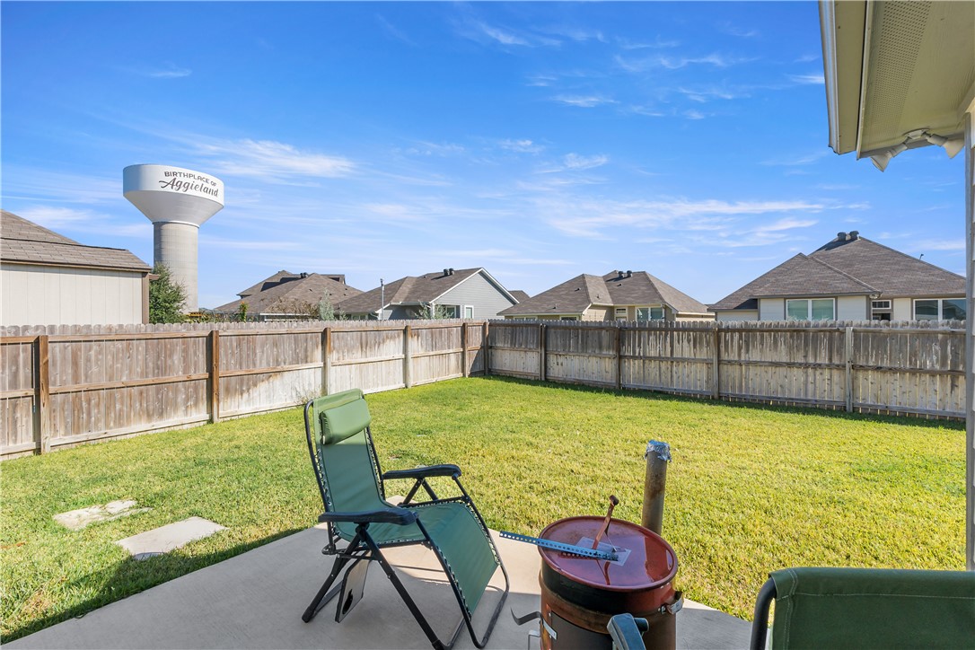 1925 Viva Road Bryan, TX 77807 - Photo 12 of 24 a view of a patio with table and chairs potted plants with wooden floor