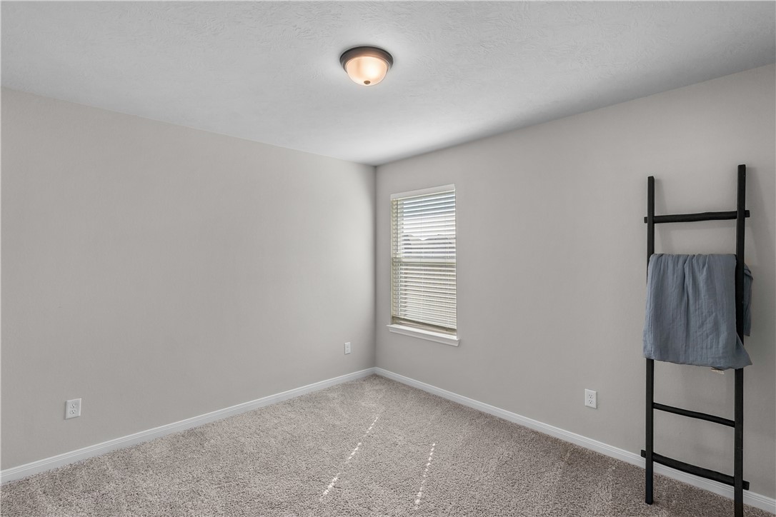1925 Viva Road Bryan, TX 77807 - Photo 16 of 24 an empty room with windows and closet