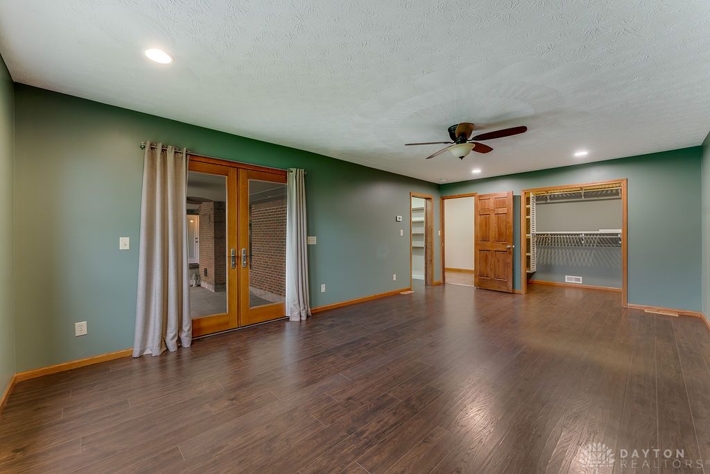 7400 Cook-Jones Road Waynesville, OH 45068 - Photo 28 of 72 This spacious room features rich wood flooring, double French doors, and ample closet space.