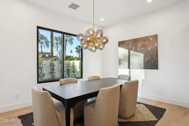 a dining room with furniture and window