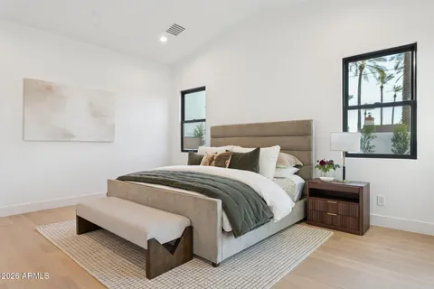 a bedroom with a bed and window