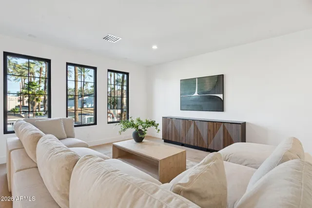 a living room with furniture and a large window