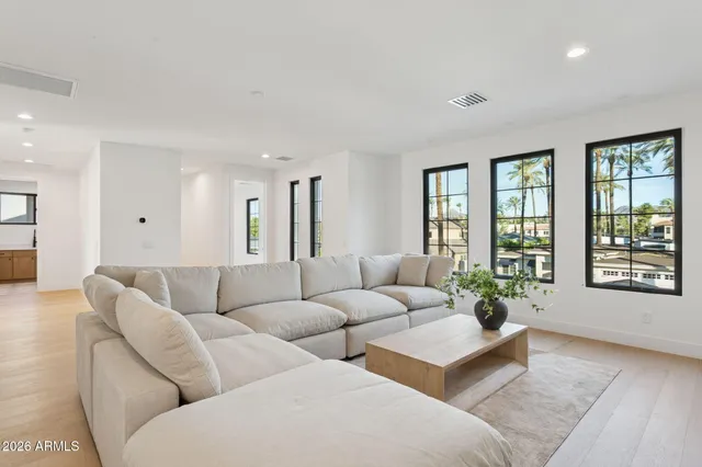 a living room with furniture and windows