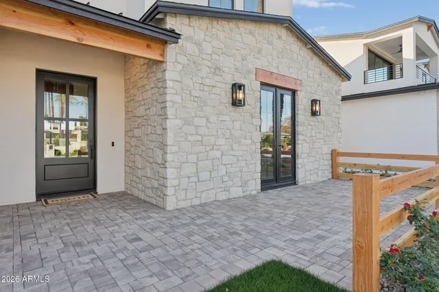 a view of a house with backyard and parking space