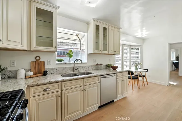 a kitchen with a sink and cabinets