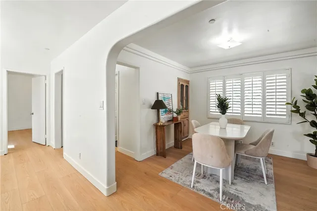 a view of a livingroom with furniture window and wooden floor