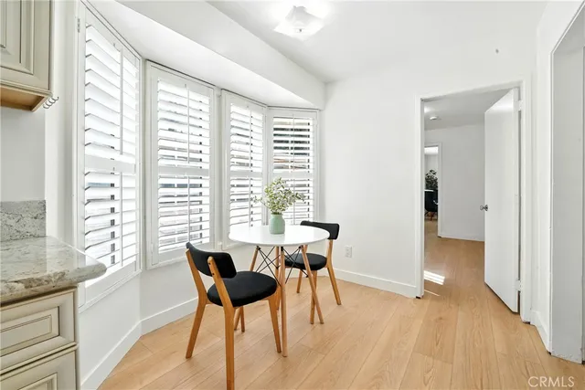 a view of a dining room with furniture and windows
