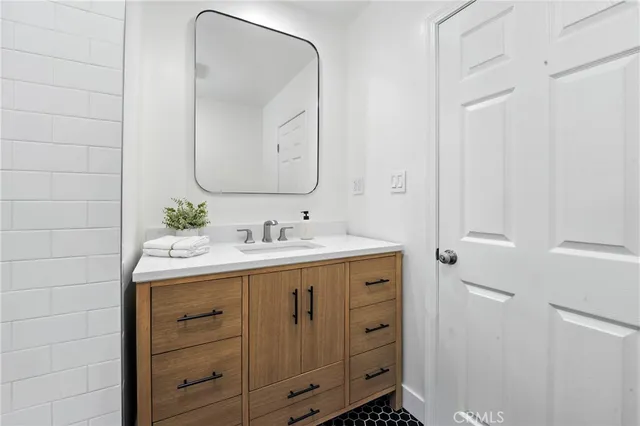a bathroom with a sink and a mirror