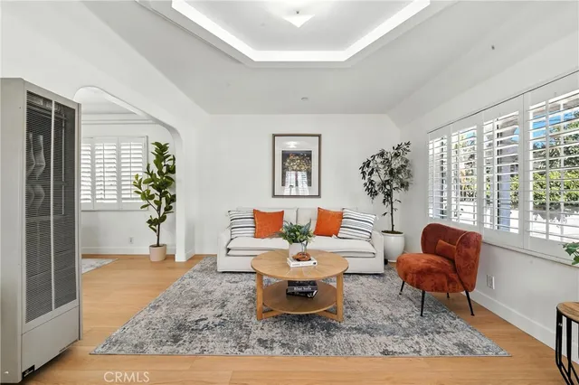 a living room with furniture rug and window